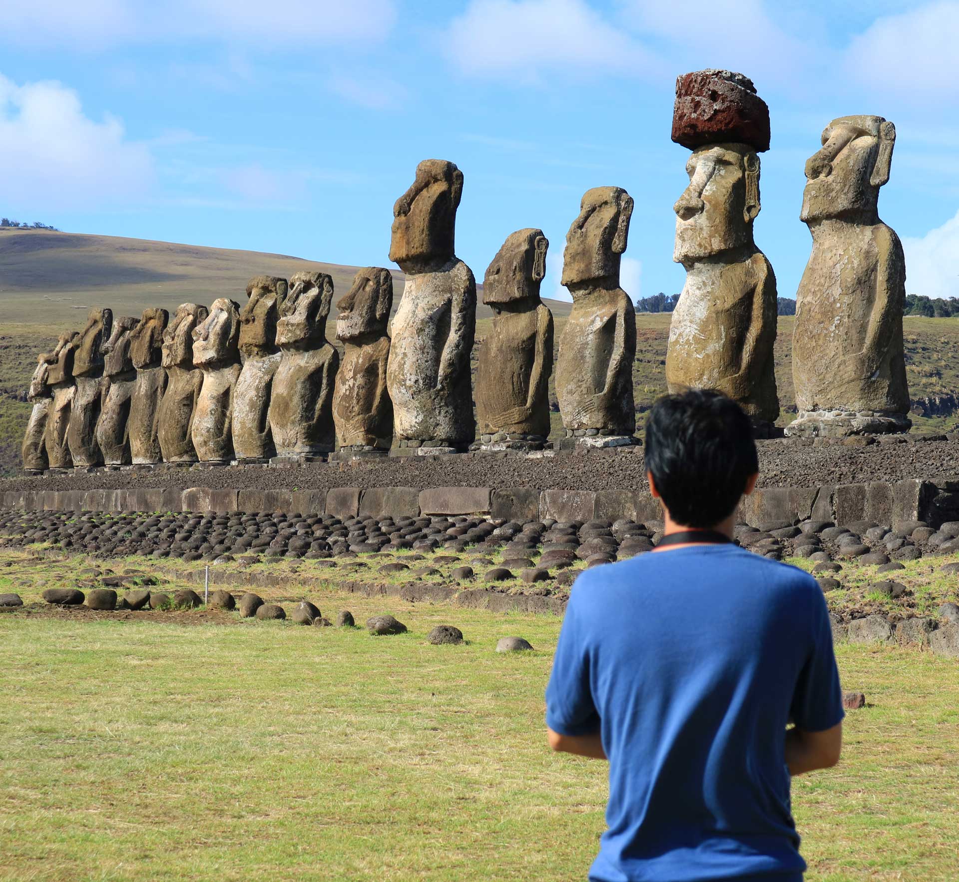 One man admiring the huge Moai statues of Ahu Tongariki, Easter Island, Chile, South America